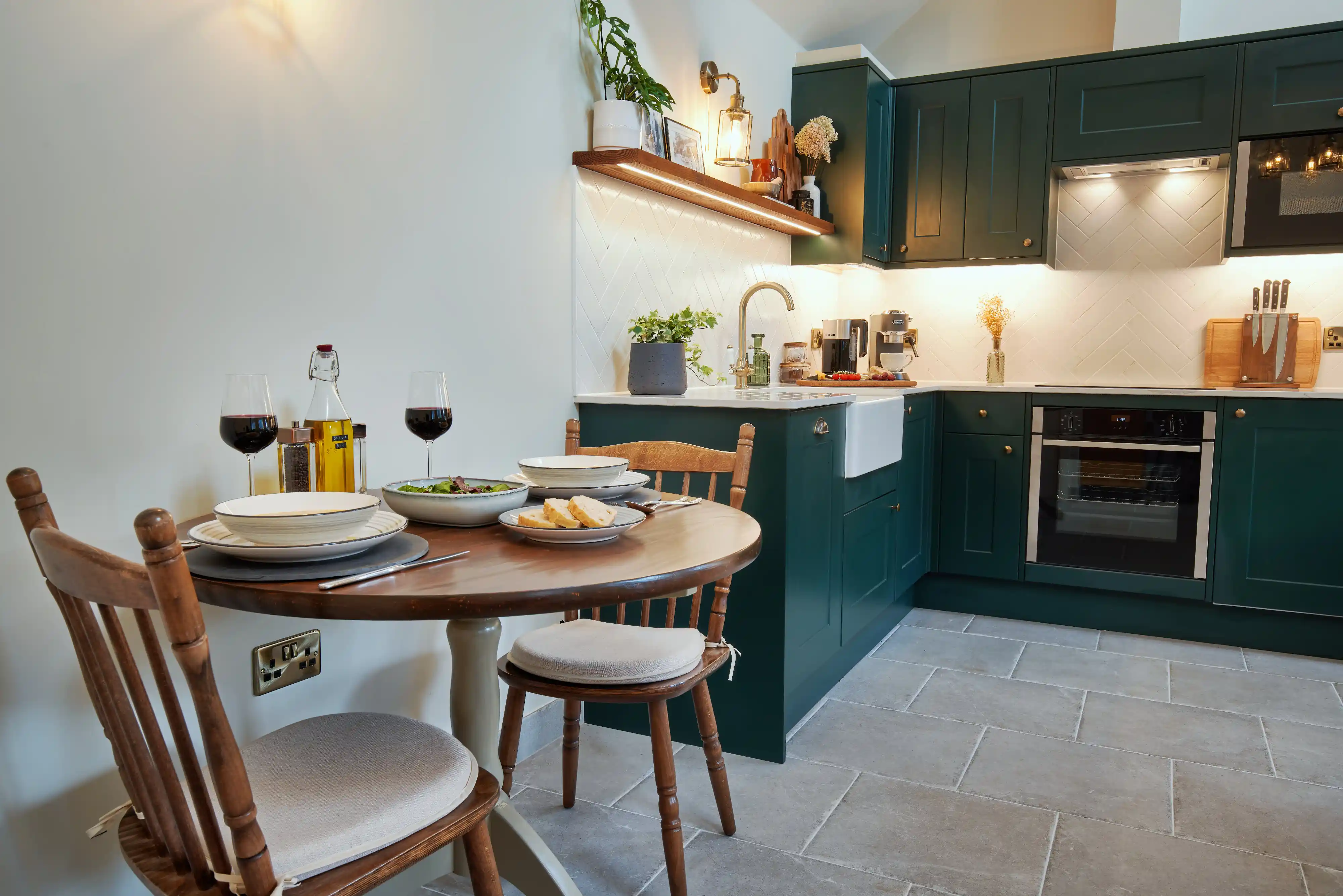 Elegant dining table set for a meal, overlooking the garden